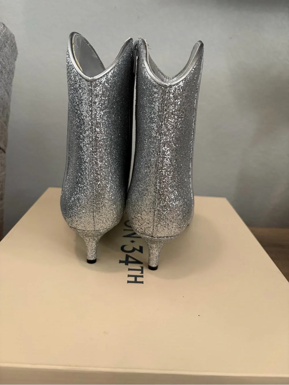 On 34th Aatira Western silver booties